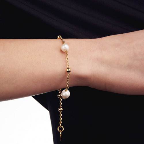 Bracciale in bronzo dorato e perle naturali Bracciale in bronzo dorato e perle naturali