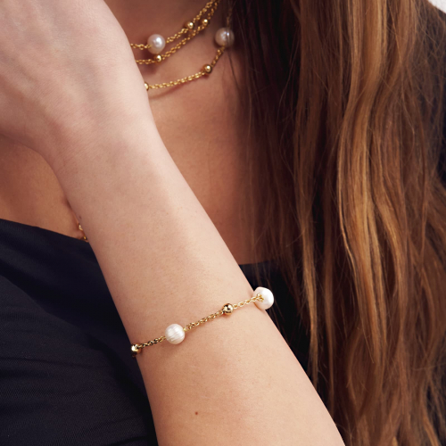 Bracciale in bronzo dorato e perle naturali Bracciale in bronzo dorato e perle naturali